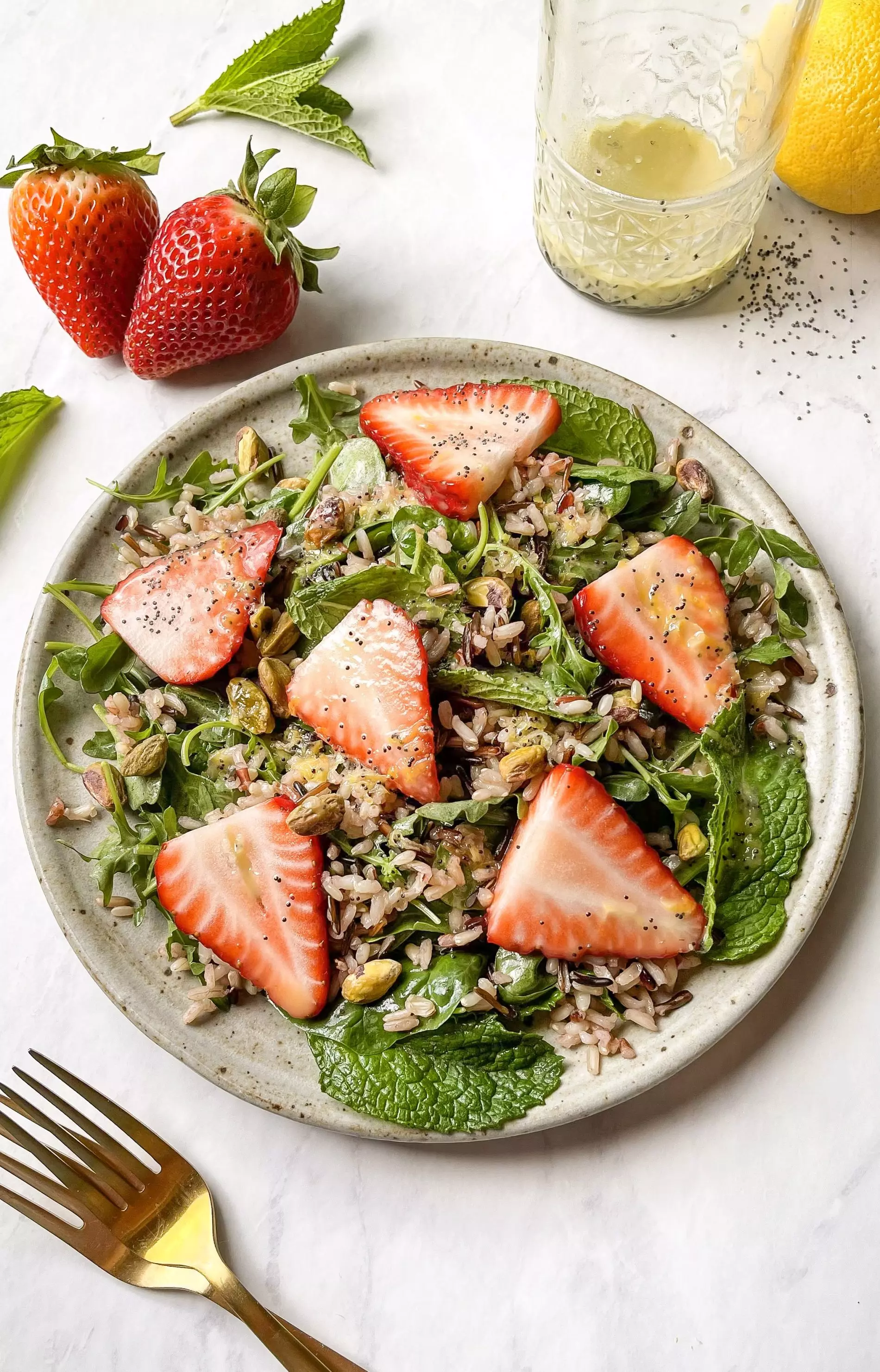 strawberry pistachio salad with lemon poppyseed vinaigrette