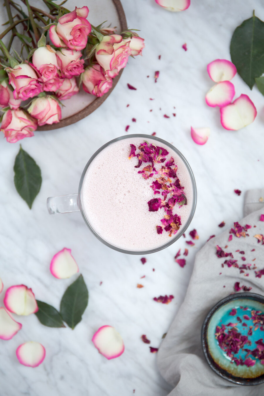 Pink rose latte in a mug with foam art